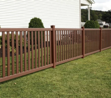 Norwalk closed picket fence in Brazilian blend around homes side yard