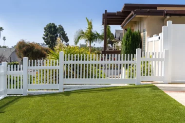 Cape Cod classic picket in white on sloped yard