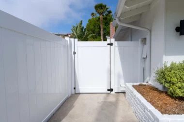 Newbury solid vertical privacy fence with gate around back yard