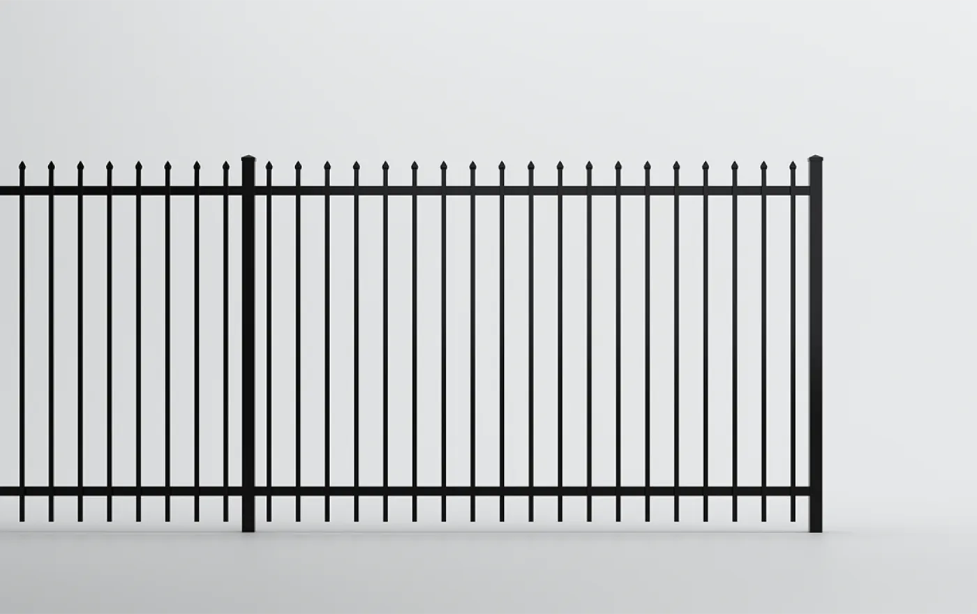 A black metal fence with vertical bars topped with decorative spikes, set against a plain white background.