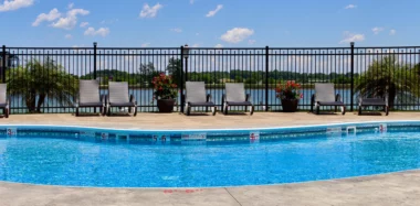 Augustine fence around pool with lounge chairs