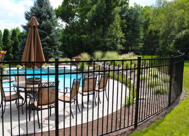 Augustine fence around landscaped pool area