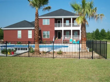 black aluminum picket fence around backyard pool area
