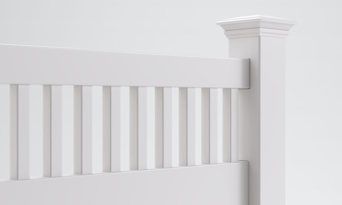 A close-up of a white wooden fence with vertical slats and a decorative square post against a plain light background. The design is simple and modern, with clean lines and smooth surfaces.