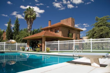 Norwalk Slim closed picket fence in white around pool with diving board