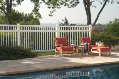 Norwalk Slim closed picket fence in white with lounge chairs