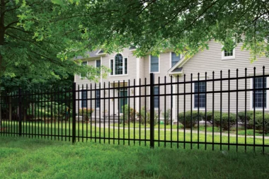 Georgetown spear top picket fence in black around front yard