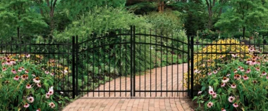 Georgetown spear top picket fence in black with arched drive through gate