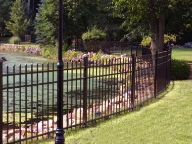 Georgetown spear top picket fence in black around pond