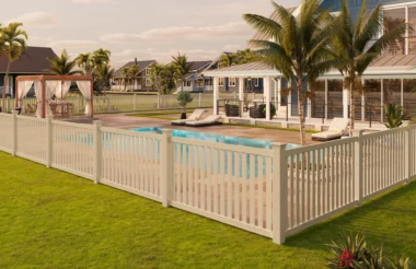 Norwalk closed picket fence in sand around homes pool area