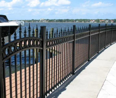 Orleans finial top picket fence along lake waterfront area