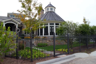 Orleans staggard finial top picket fence around front yard