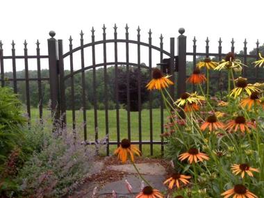 Orleans finial top picket fence with arched walk through gate