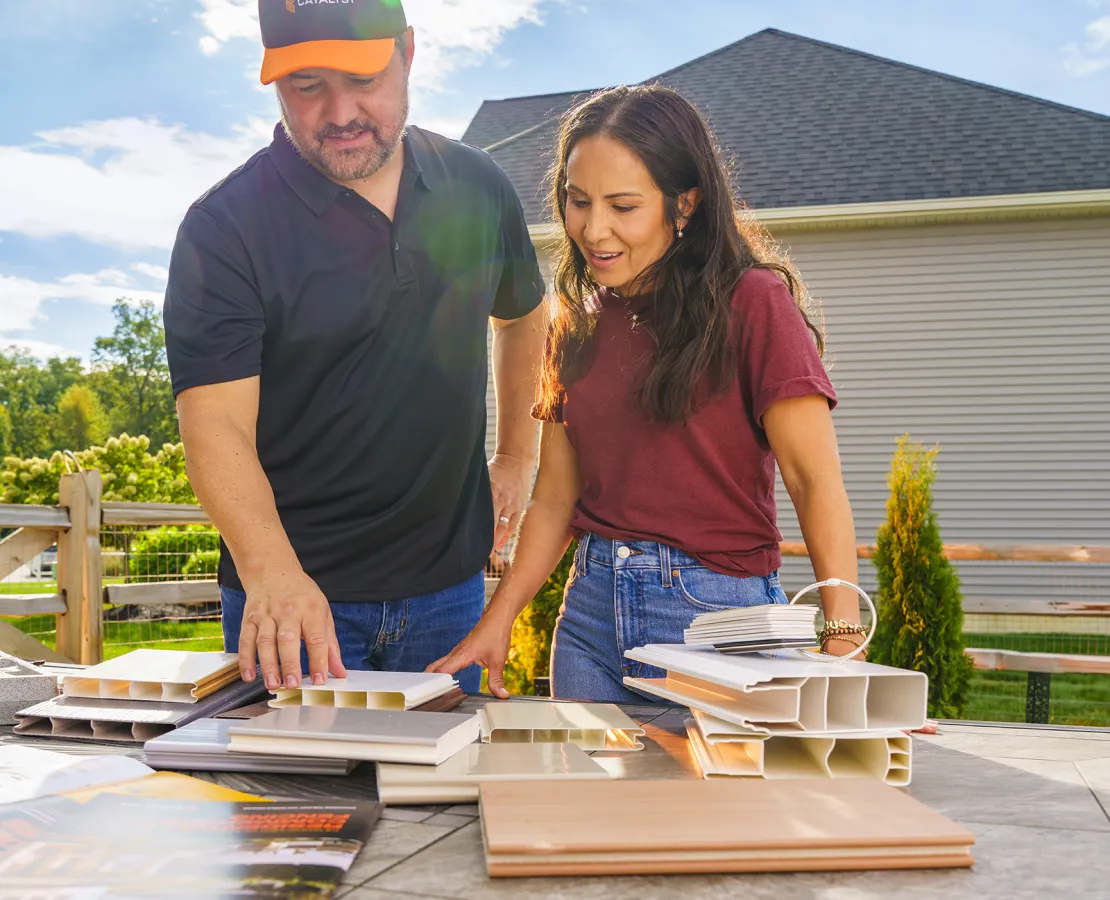 professional reviewing physical samples with a homeowner